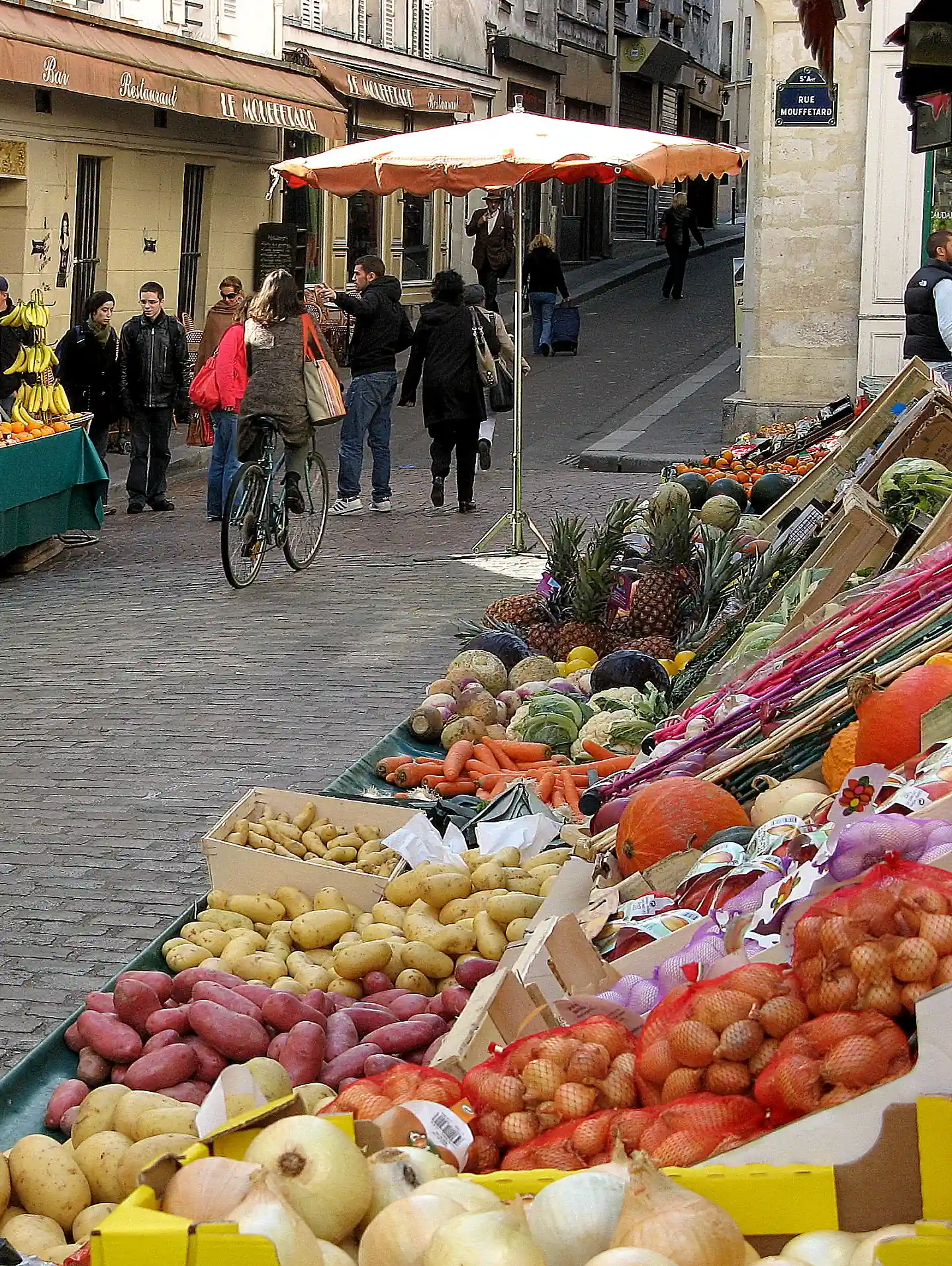 Colorful market stalls with fresh produce on Rue Mouffetard